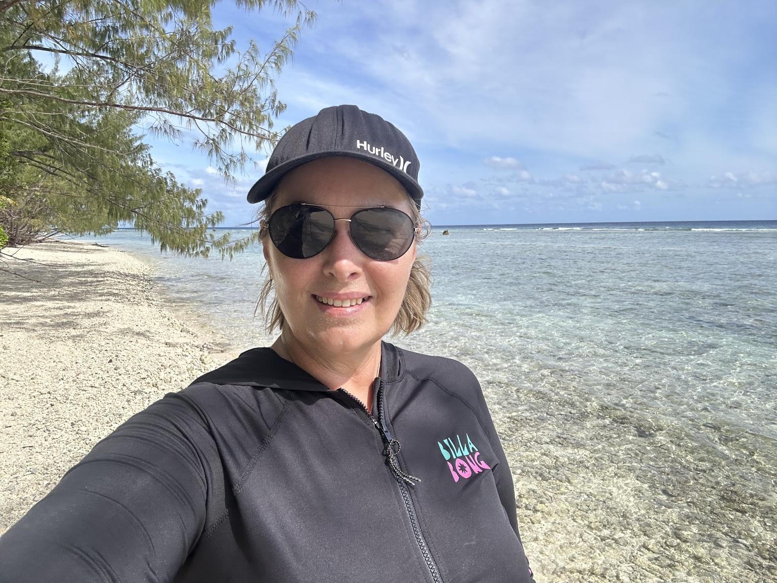Tanya beside a clear tropical sea
